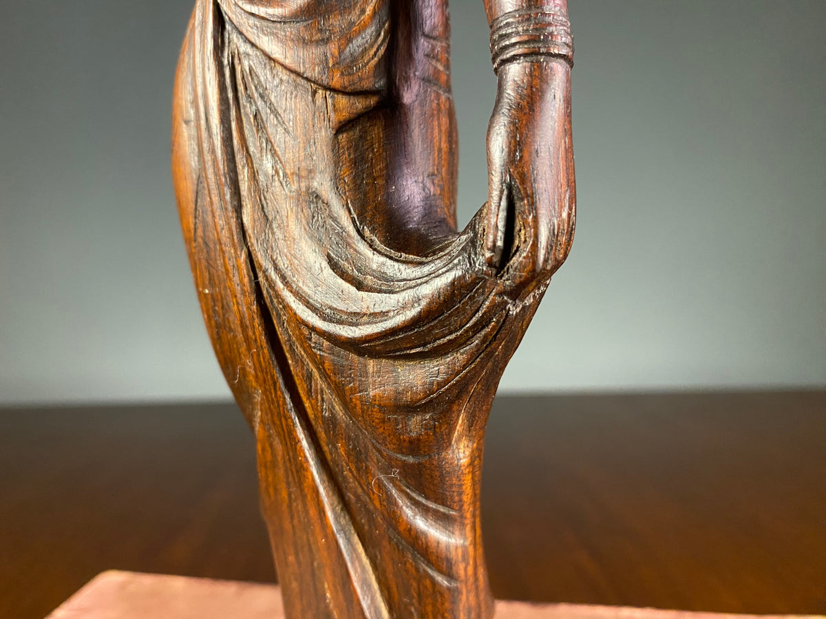 Carved Wooden Figure of a Woman Carrying a Vessel