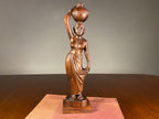 Carved Wooden Figure of a Woman Carrying a Vessel
