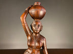 Carved Wooden Figure of a Woman Carrying a Vessel