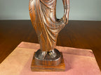Carved Wooden Figure of a Woman Carrying a Vessel