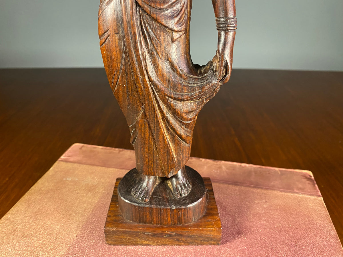 Carved Wooden Figure of a Woman Carrying a Vessel