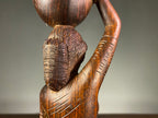 Carved Wooden Figure of a Woman Carrying a Vessel