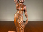 Carved Wooden Figure of a Woman Carrying a Vessel