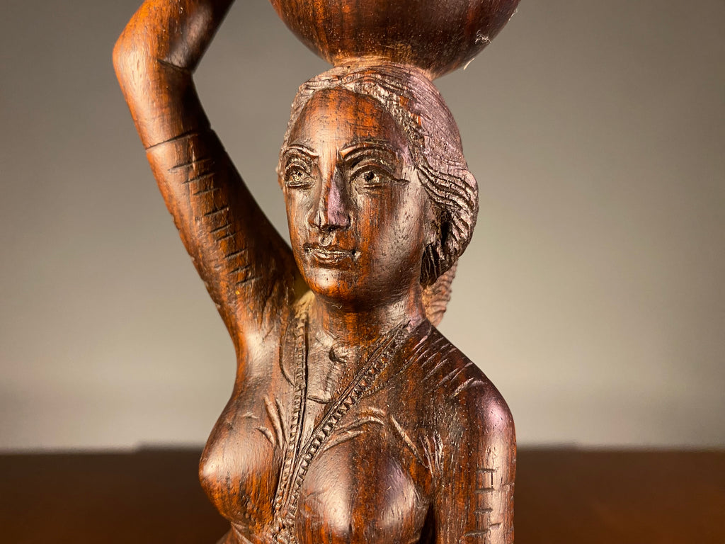 Carved Wooden Figure of a Woman Carrying a Vessel