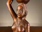 Carved Wooden Figure of a Woman Carrying a Vessel
