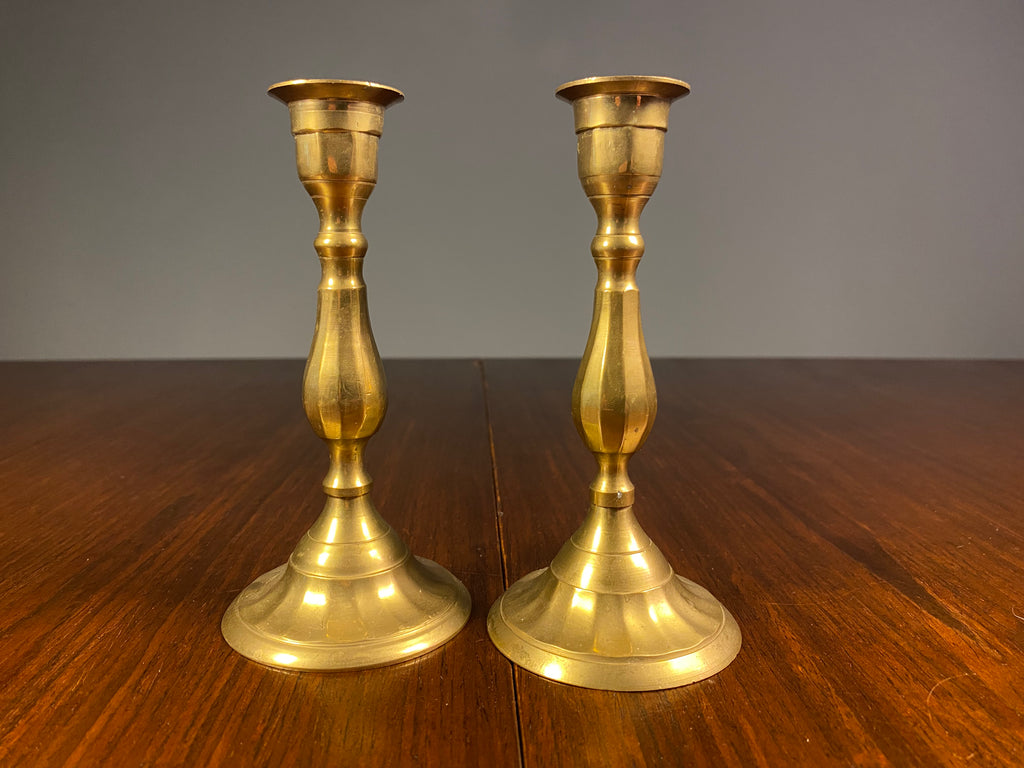 Pair of small vintage brass candlesticks with aged patina